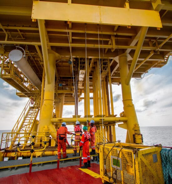Supply boat or crew boat transfer cargo to offshore platform and moving cargo from the boat to the boat access platform.