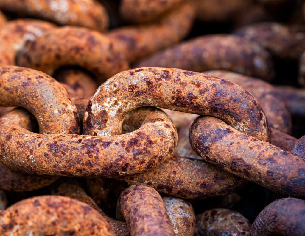 big metal chains exposed to galvanic corrosion