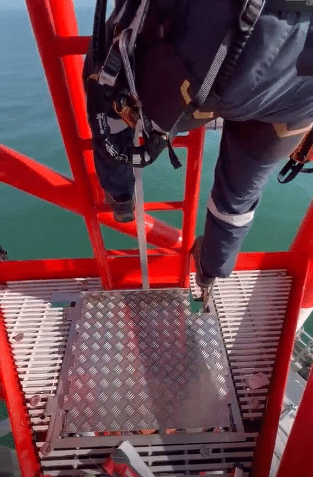 offshore workers opening the FOHO with his foot