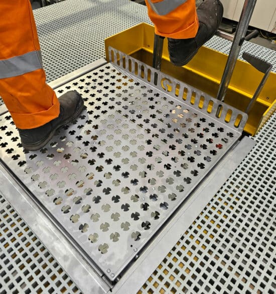 Internal hatch for ladder with someone standing on the hatch